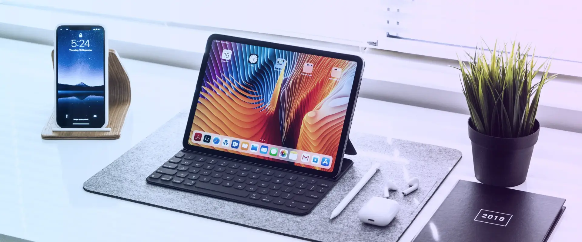 Laptop on a minimal desk showing a website